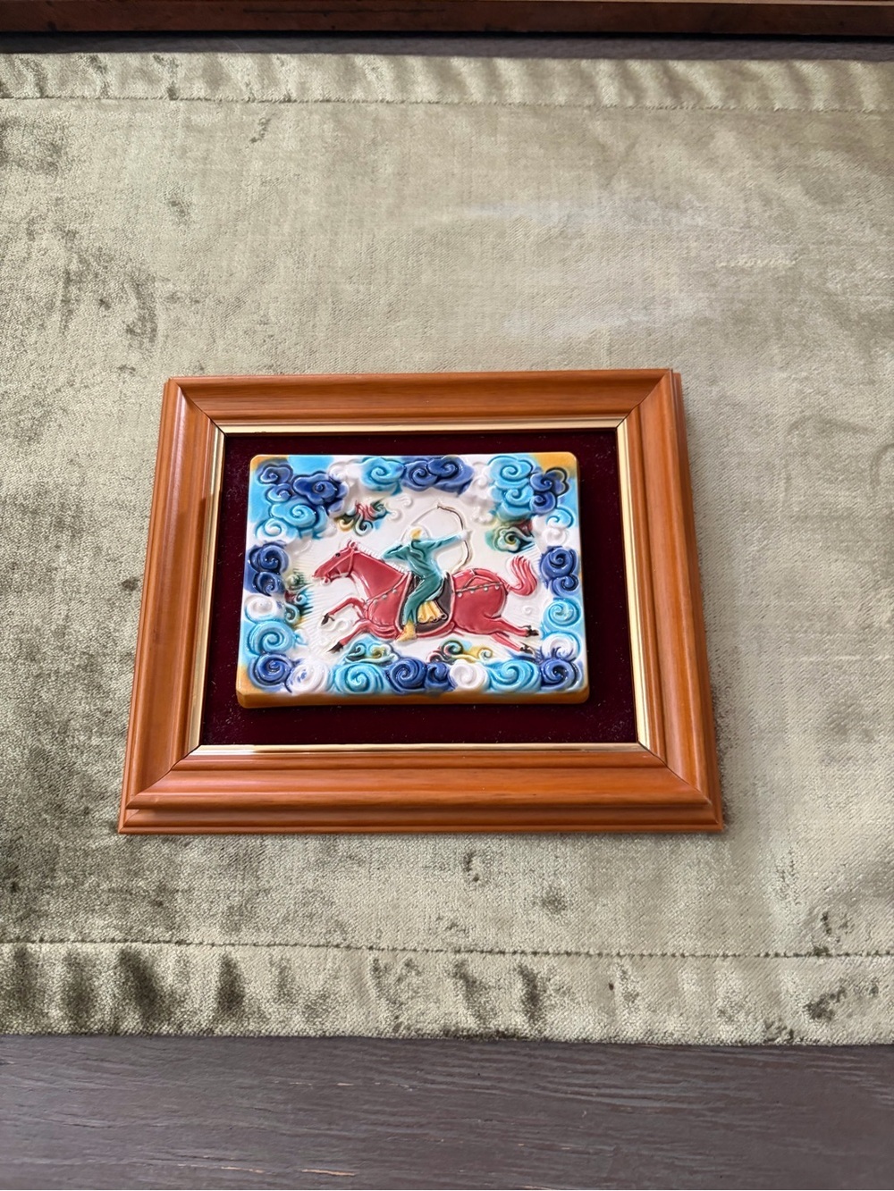Framed Ceramic Plaque with Red Horse and Green Rider